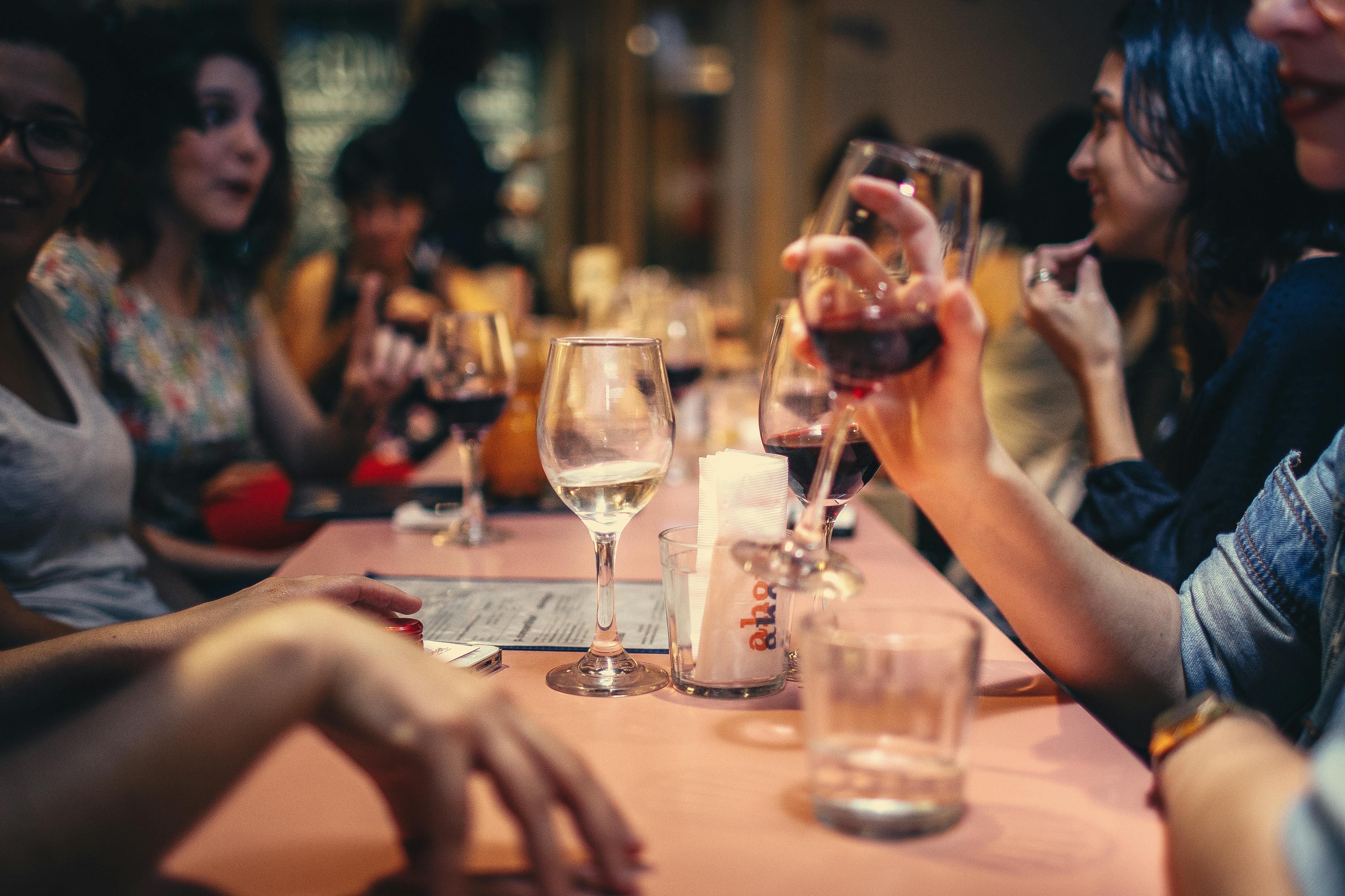 Friends cheering with wine glasses